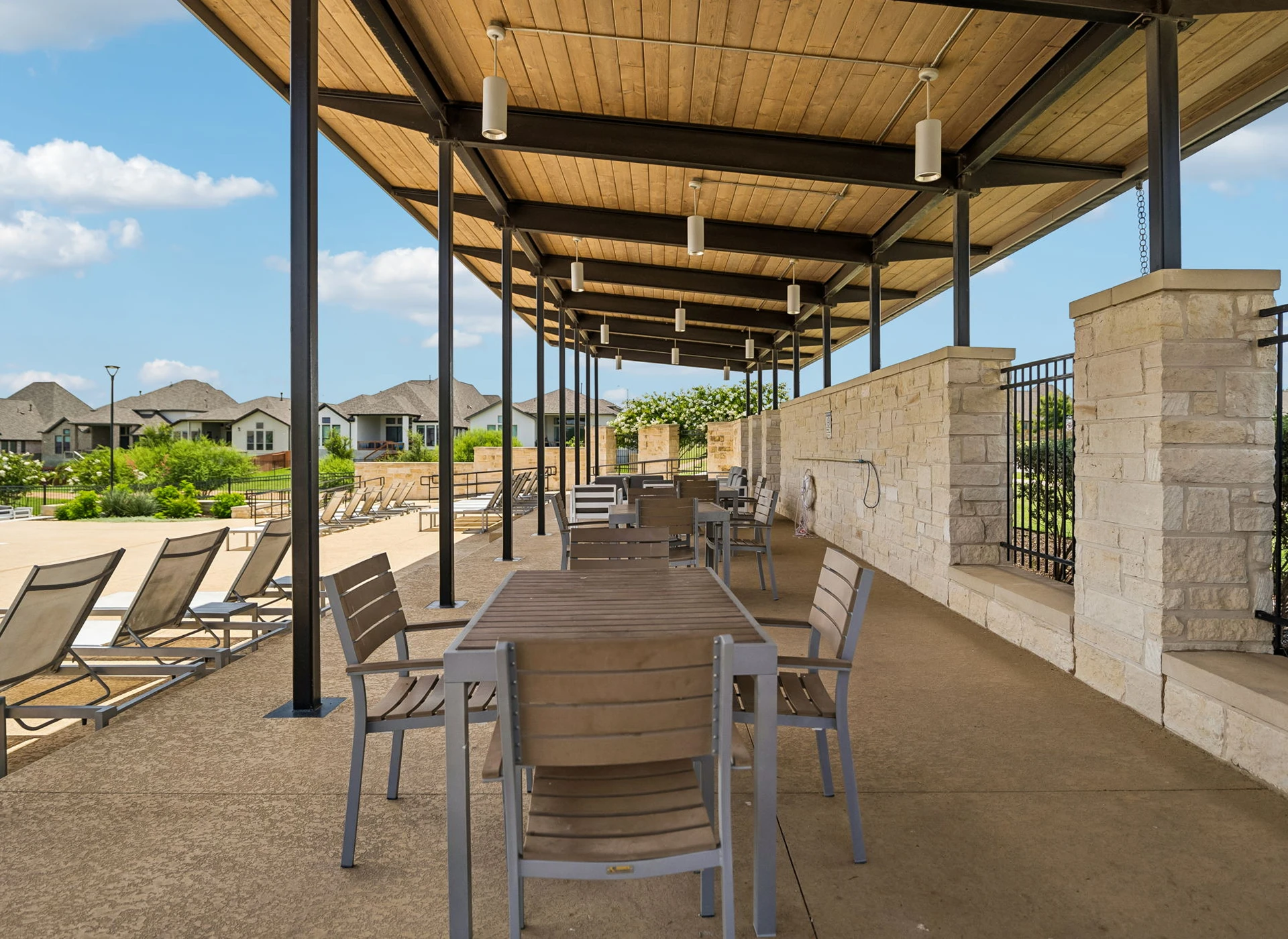 Outdoor patio with tables and chairs.