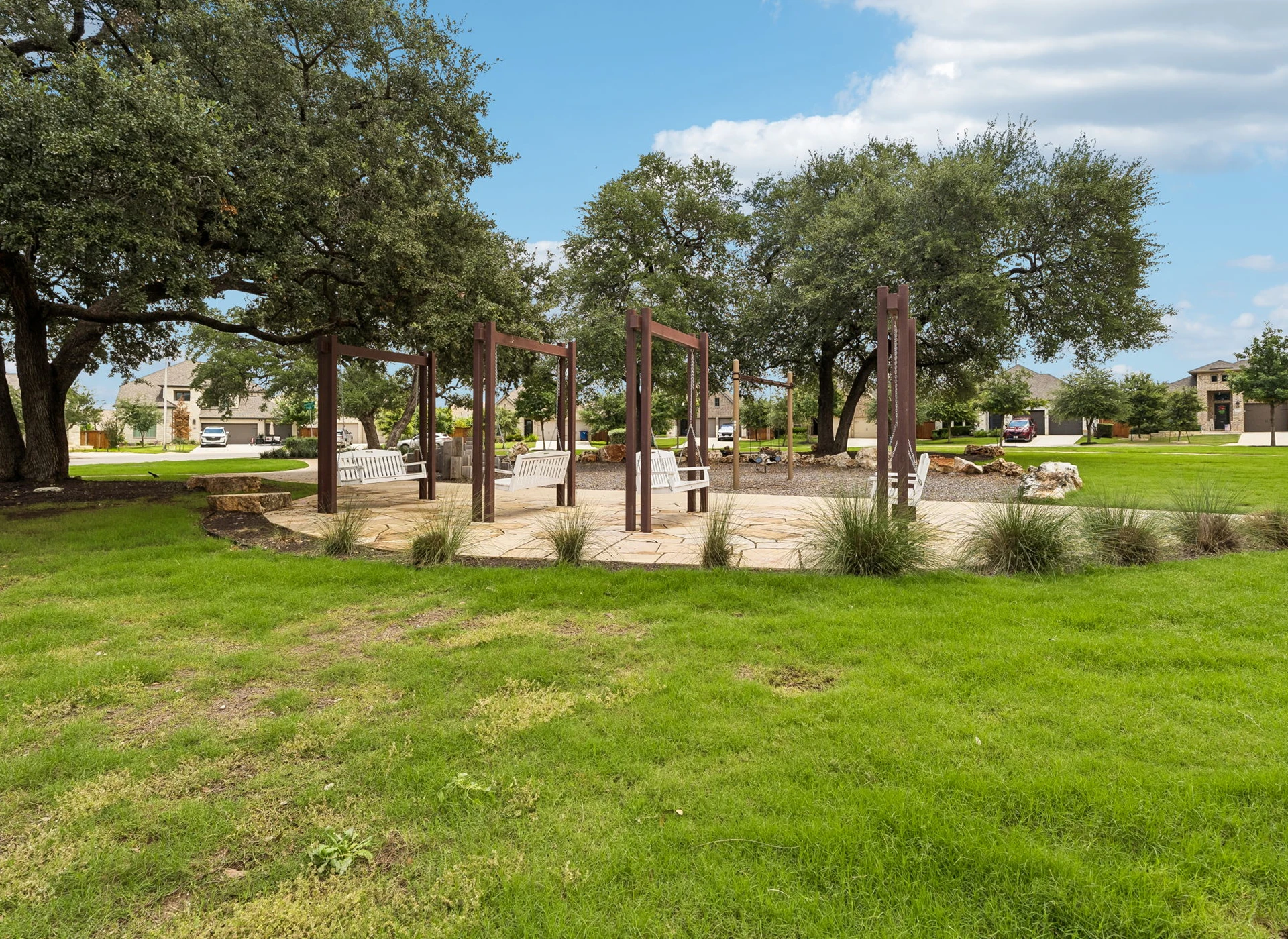 Outdoor seating area with wooden pergola structure.