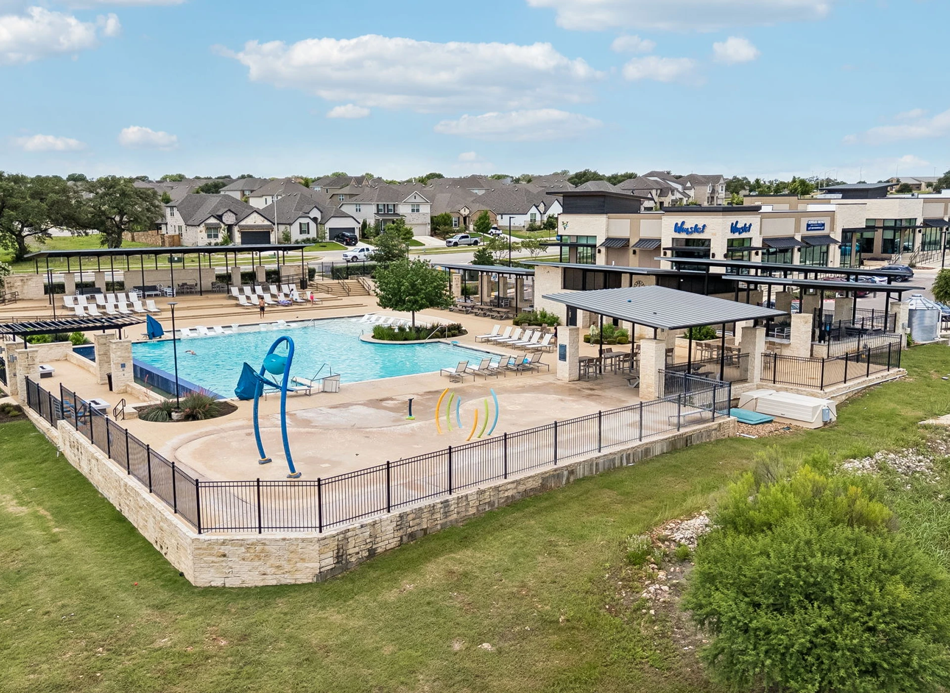 Community pool with lounge and splash area.