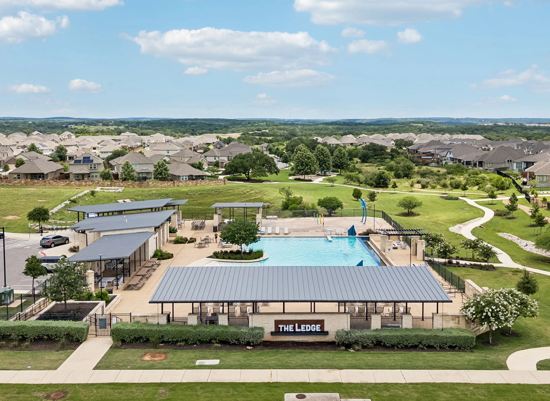Community pool and recreation area aerial view.