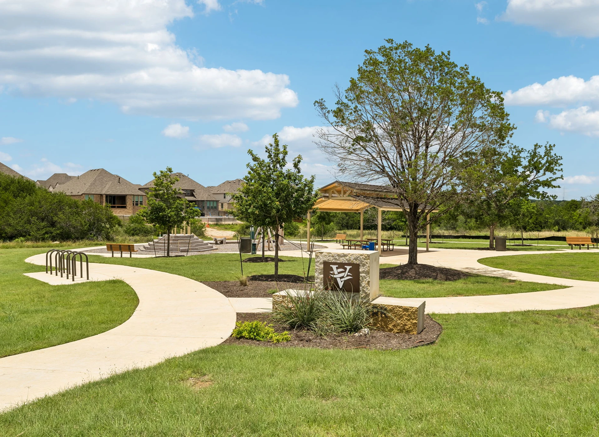 Community park with winding paths and trees.